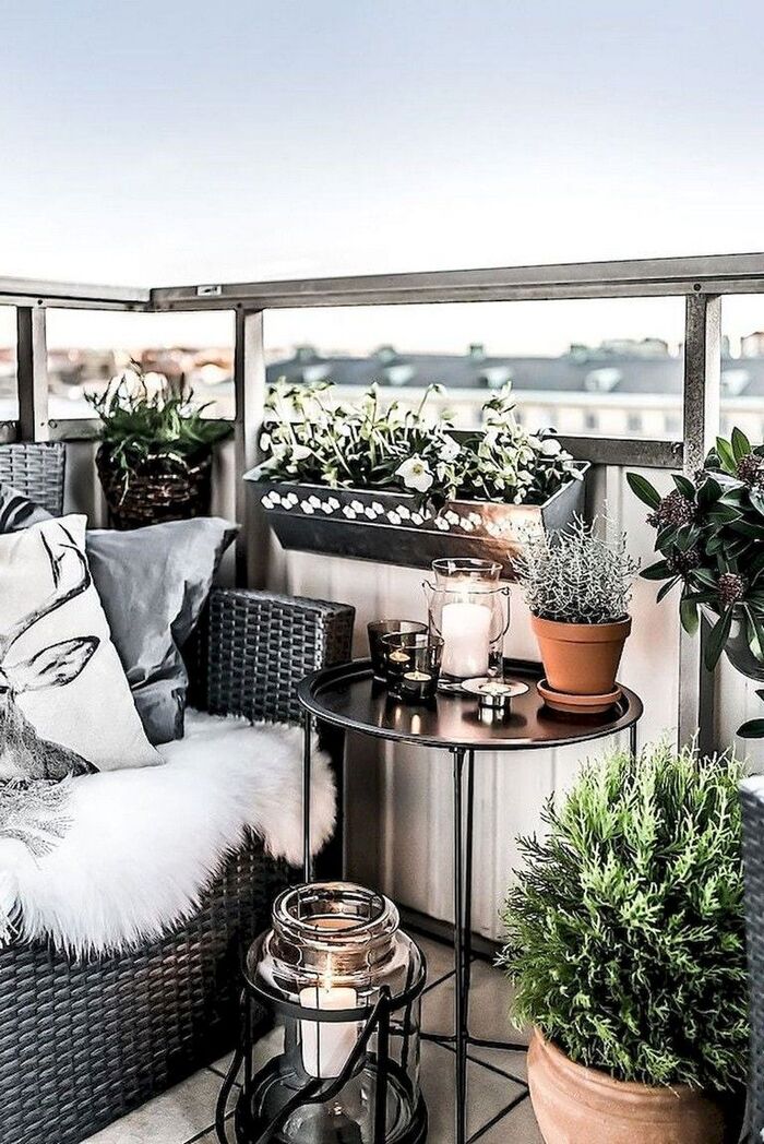 modern balcony decor overlooking a city in black and white color scheme