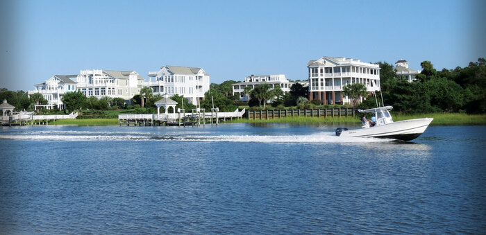 seascape villas stunning sea views a boat and white buildings in the background