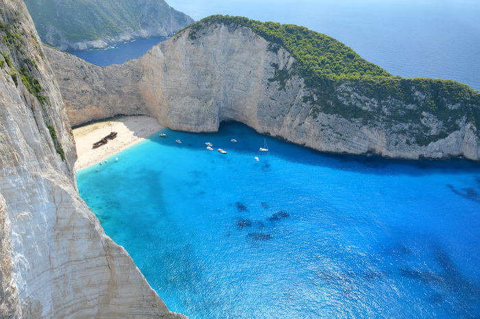 Zakynthos beach with a famous shipwreck white sands between white rocks and a turquoise waters