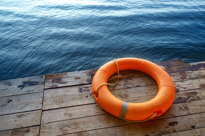 beach water orange lifeguard beach safety wooden quay blue water 