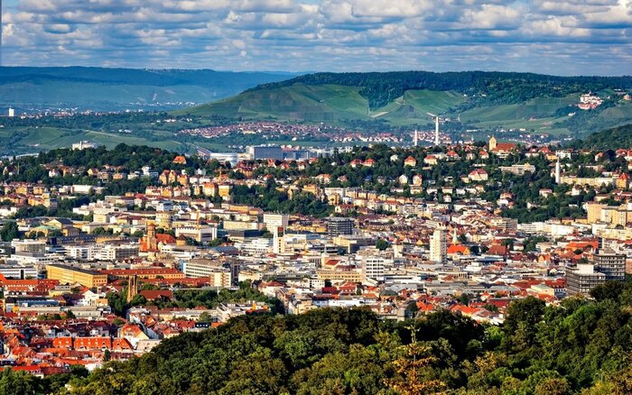 stuttgart city seen from above with green mountains and hills all around