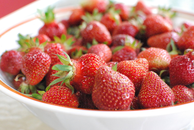 a large bowl of fresh organic strawberries
