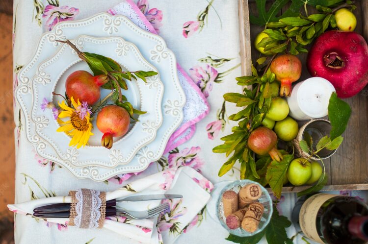 pomegranate table arrangement and decoration with vintage plates and romantic vibe