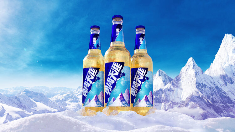 snow beer ad three bottles in the mountains shot in the snow with peaks and blue sky in the background
